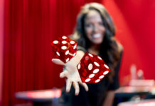 image of woman throwing dice