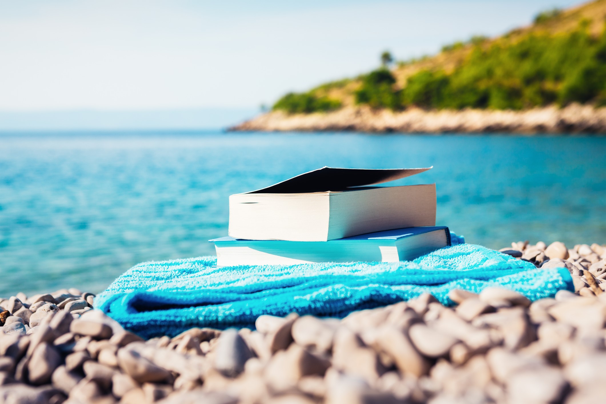 image of books at the beach